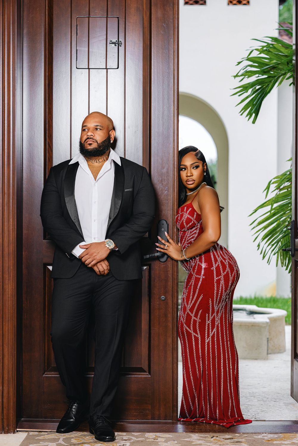 Elegant Miami engagement session couple at a doorway