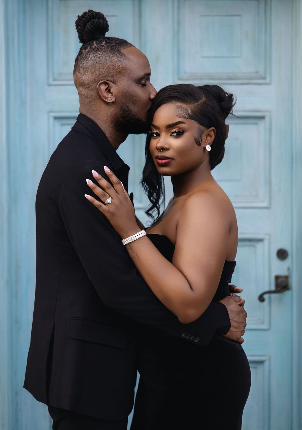 South Florida engaged couple embracing at their engagement session