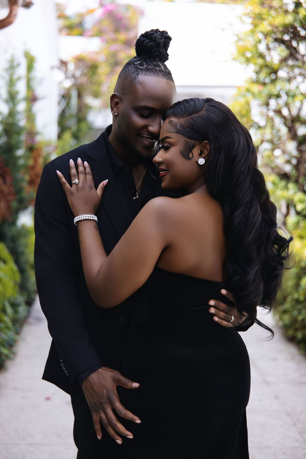 South Florida engagement session — couple in elegant black formalwear
