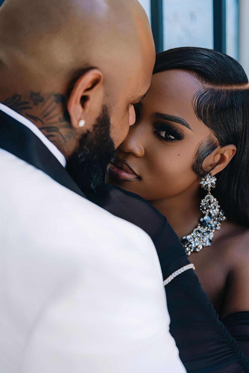 South Florida engagement session — couple in elegant black formalwear