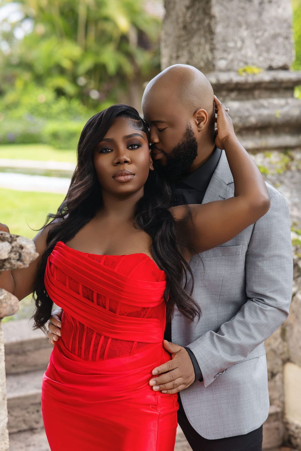 Miami engagement photos — couple in a red evening look