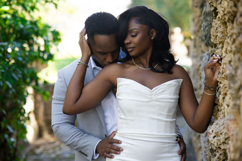 Editorial engagement portrait — couple in white