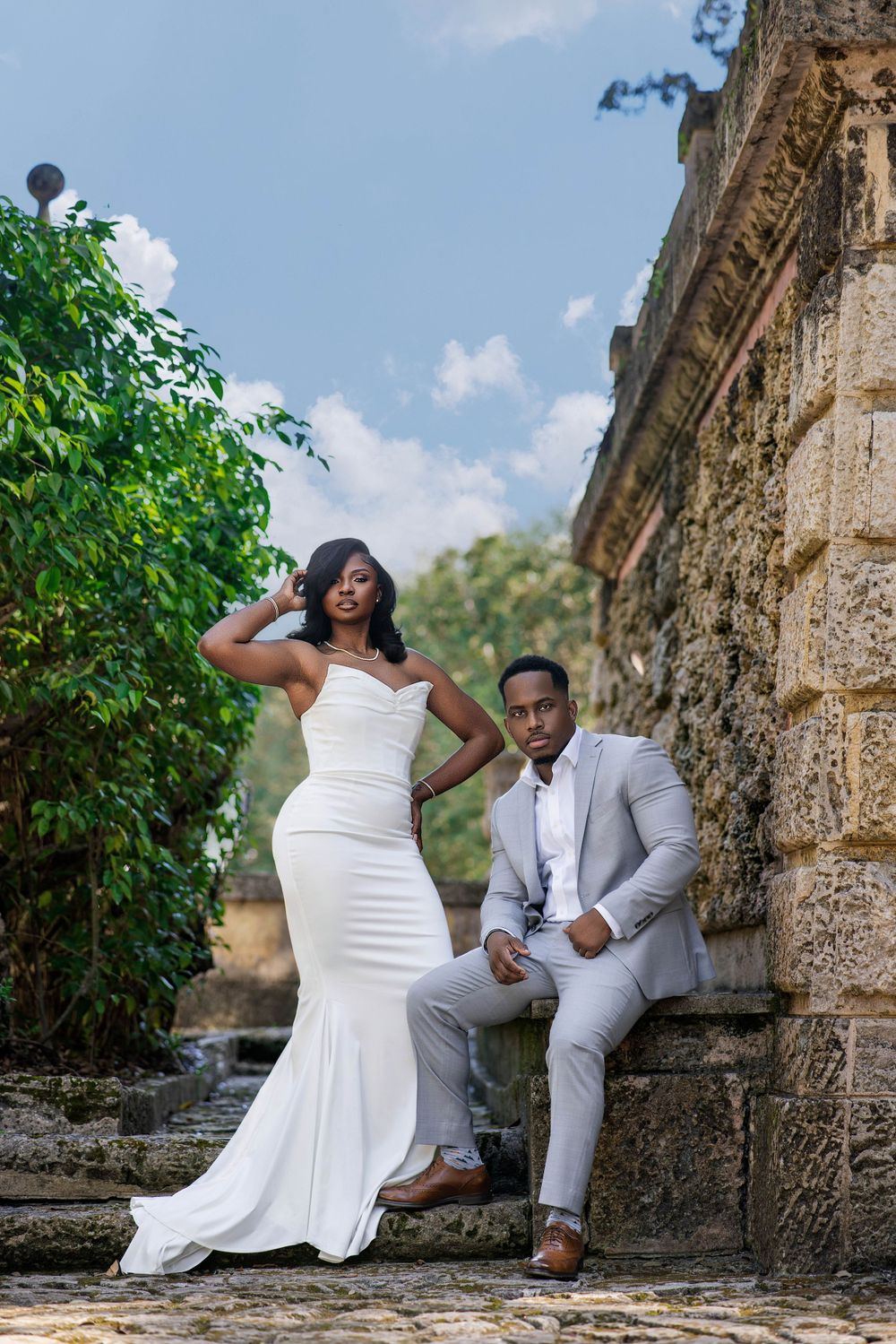 Editorial engagement portrait — couple in white