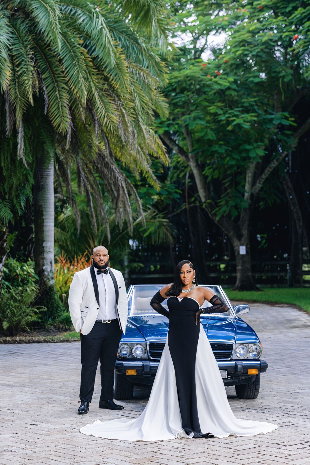 Editorial engagement portrait — couple in white